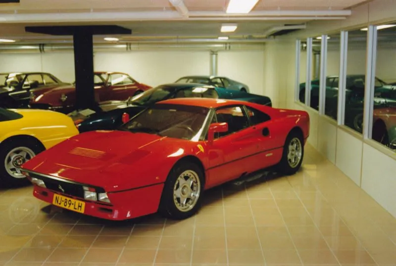 A red 288 GTO with Dutch plate NJ-89-LH in a showroom