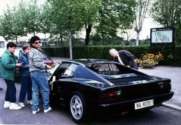 A black Testarossa from the rear, with registration NA N93951